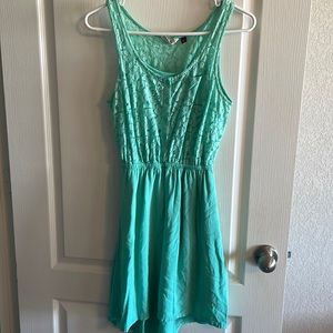 Junior small mint dress.63% cotton, 30% nylon, lining 100% polyester, lace shell